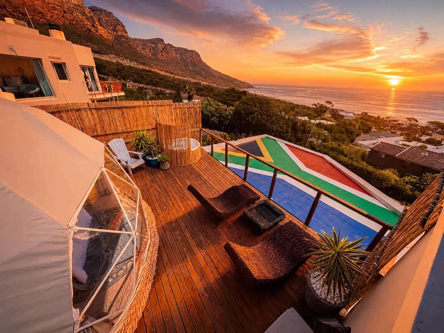 Geodesic dome on a sea-view deck at sunset